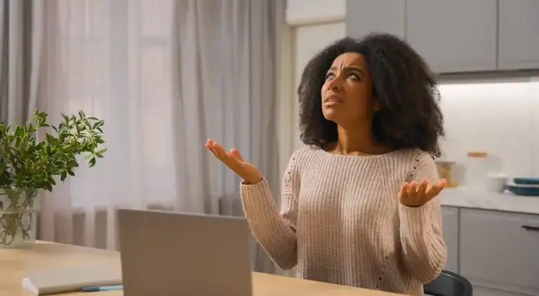 Person staring up at the ceiling in a state of confusion as to why the AC isn't working.