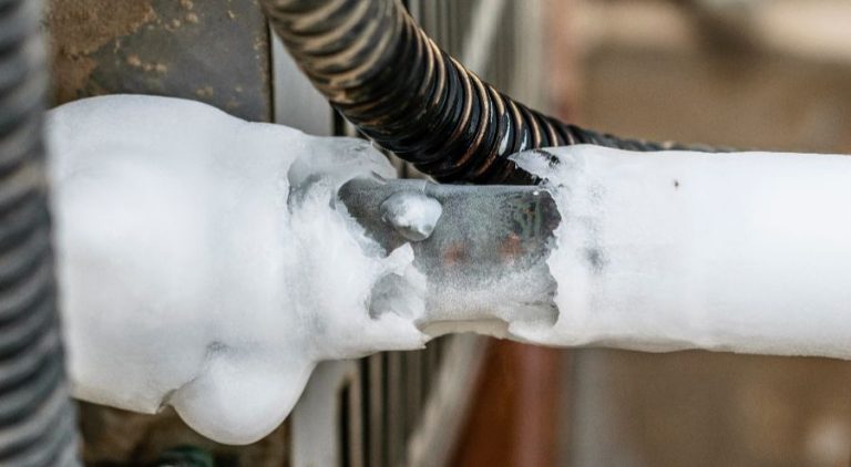 Air conditioning unit with ice building up on the coils.