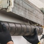 A worn down air conditioning unit in thorough need of replacement.