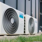 An air conditioning unit, outside of a home.