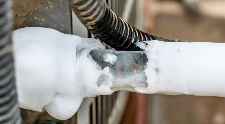 Air conditioning unit with ice around the coils.