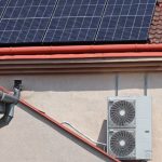 Rooftop solar panels powering a home air conditioner system in Las Vegas