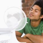 Someone needing a fan to keep cool because of a short cycling ac.