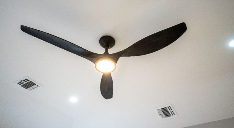 Ceiling fan with light on.